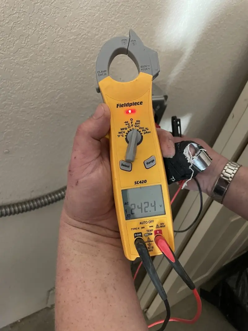 Voltage testing with clamp meter during Electrical Installation Services in Lombard